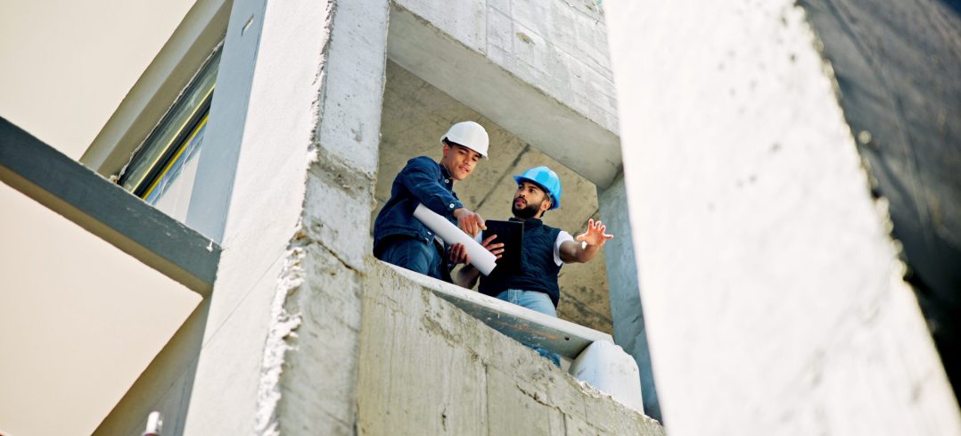 Businessmen, civil engineer and building with blueprint for industrial development or construction .